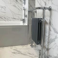 Calacatta grande silk porcelain wall and floor tiles 600x600mm fitted in a luxury bathroom with designer radiator