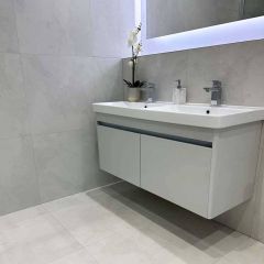 Imperial lappato porcelain floor and wall tiles in a luxury bathroom with grey wall hung sink