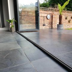 Natural Black Slate 600x600mm indoor outdoor tiles with open bifold doors