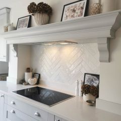 Paris pearl brick wall tiles in a soft white hand painted kitchen, fitted as a kitchen splashback in herringbone style.