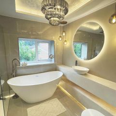 Perla soft 600x600mm wall and floor tiles in instagram blogger's @thegreybuild bathroom with chandelier _freestanding bath and round mirror