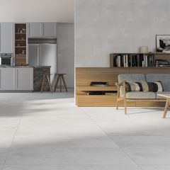 Valentina White XL porcelain floor tiles pictured in an open plan kitchen living room area.