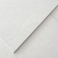 Close up picture of valentina white wall and floor tiles showing the delicate print