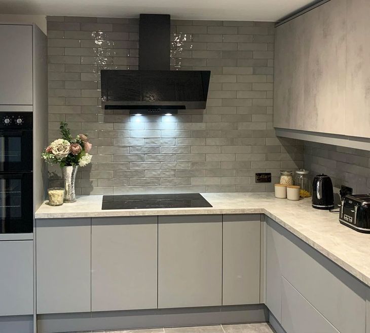 paris silver brick wall tiles in a contemporary grey kitchen space