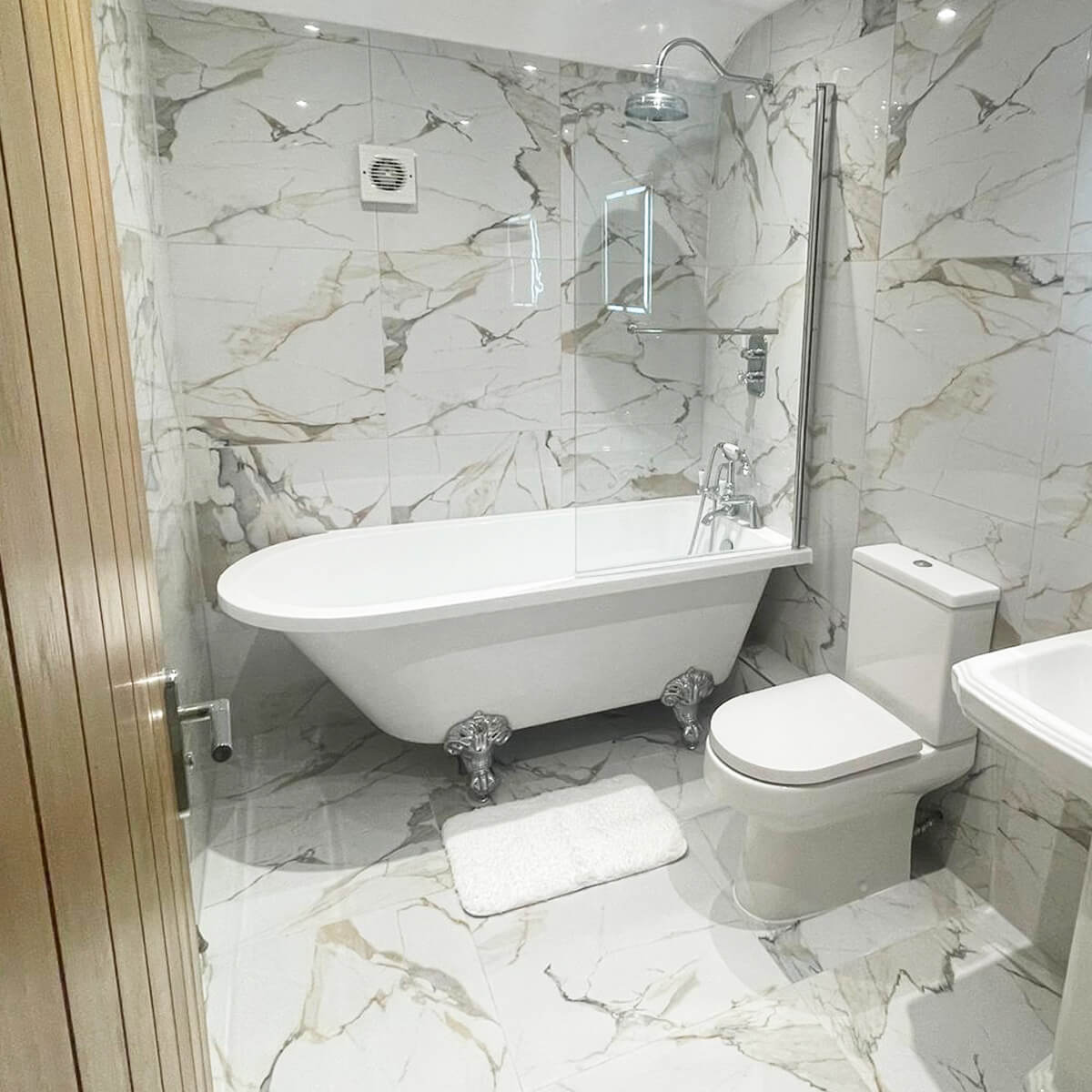 bold gold and grey marble effect tiles in a bathroom setting