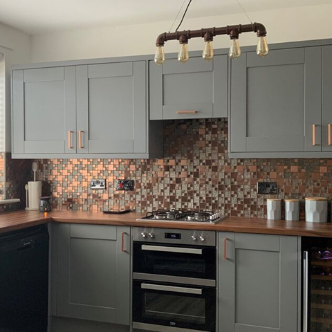 A kitchen with lunar copper and brass metal glass modular mosaic tiles