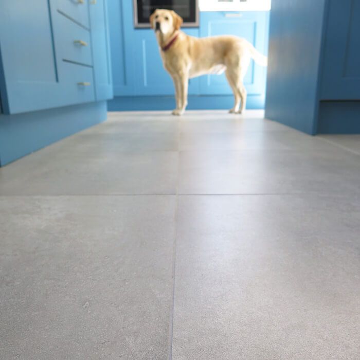 Hardwearing and slip resistant urban grey concrete cement effect floor tiles in a domestic kitchen area with high footfall