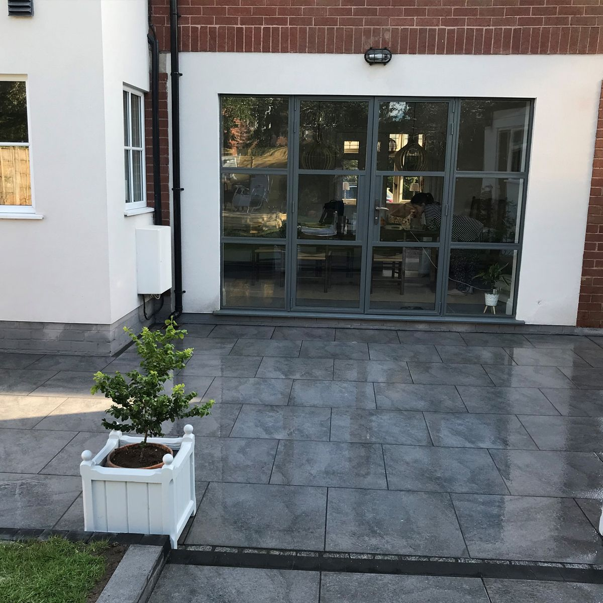 patio tiles in loft dark grey stone concrete effect porcelain outdoor slabs