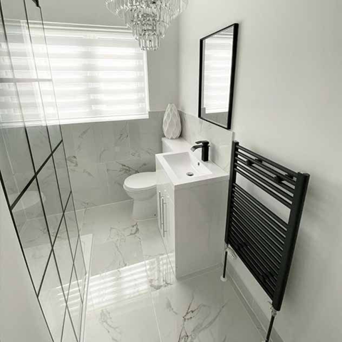 Carrara white 600x600mm marble tiles in a contemporary bathroom setting 