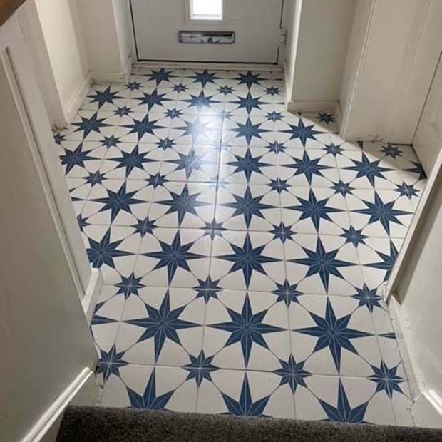 Lyra Blue Star patterned tiles in a hallway