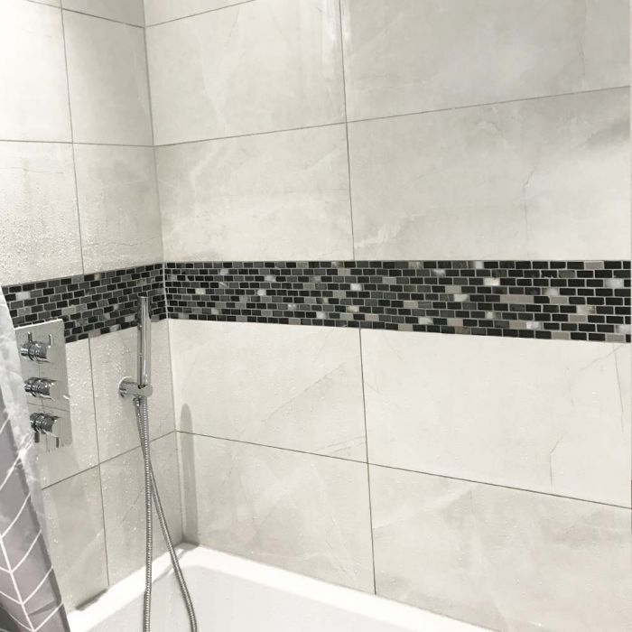 A shower area with Midas shell metallic brick mosaic wall tiles 