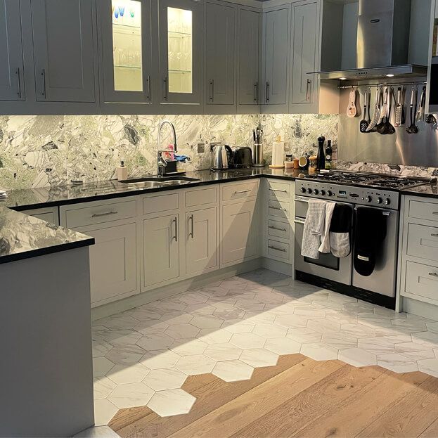 Carrara satin hexagon tiles in a kitchen floor setting 